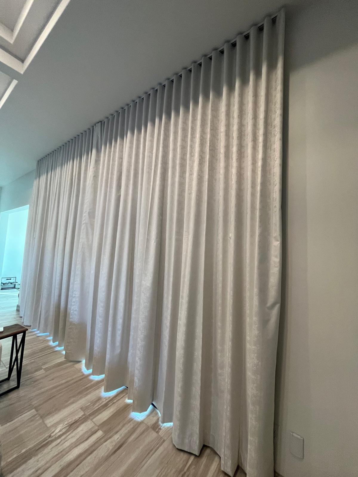 Textured white fabric drapery, floor to ceiling