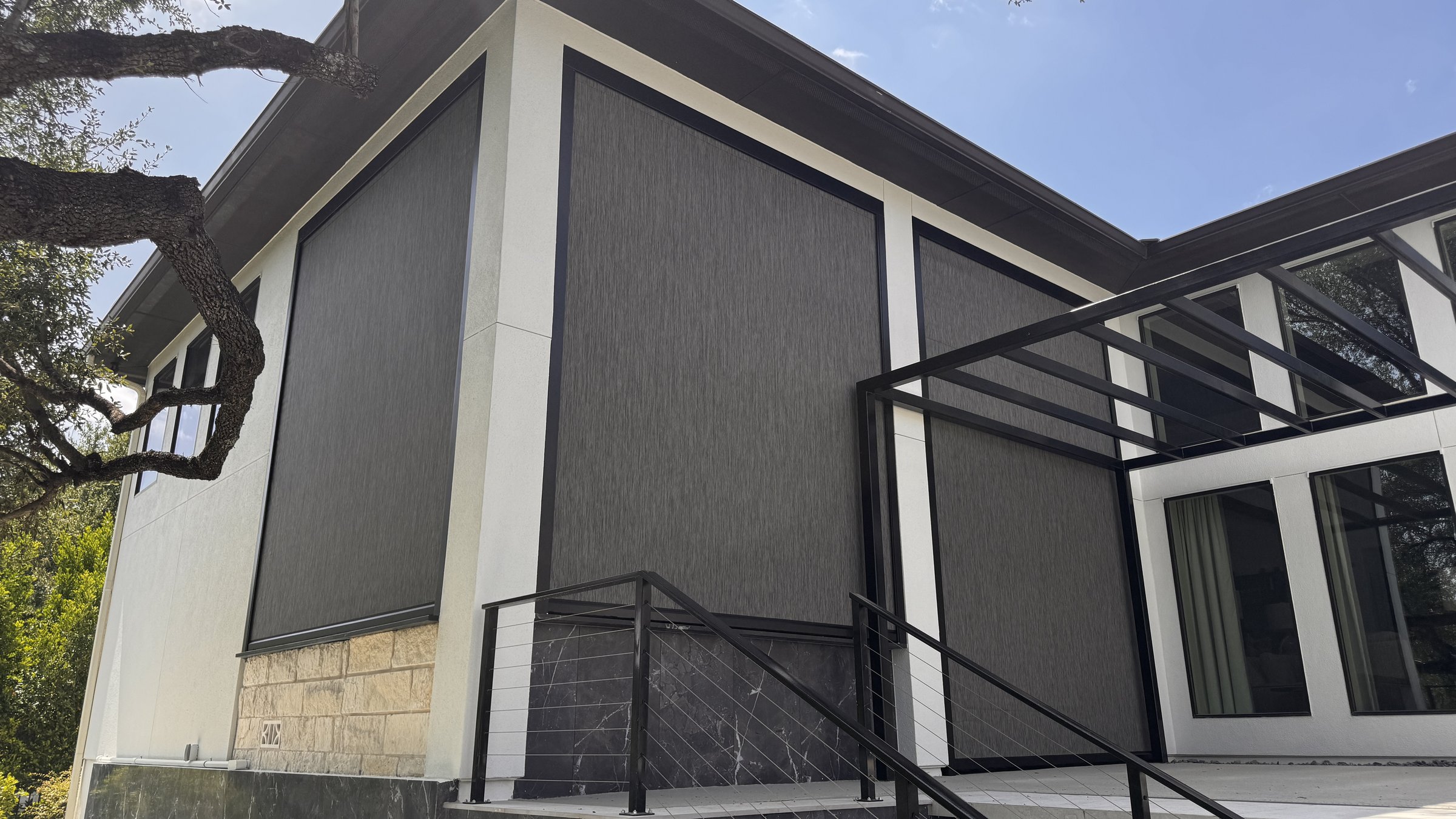 Graphite solar screen, modern facade view