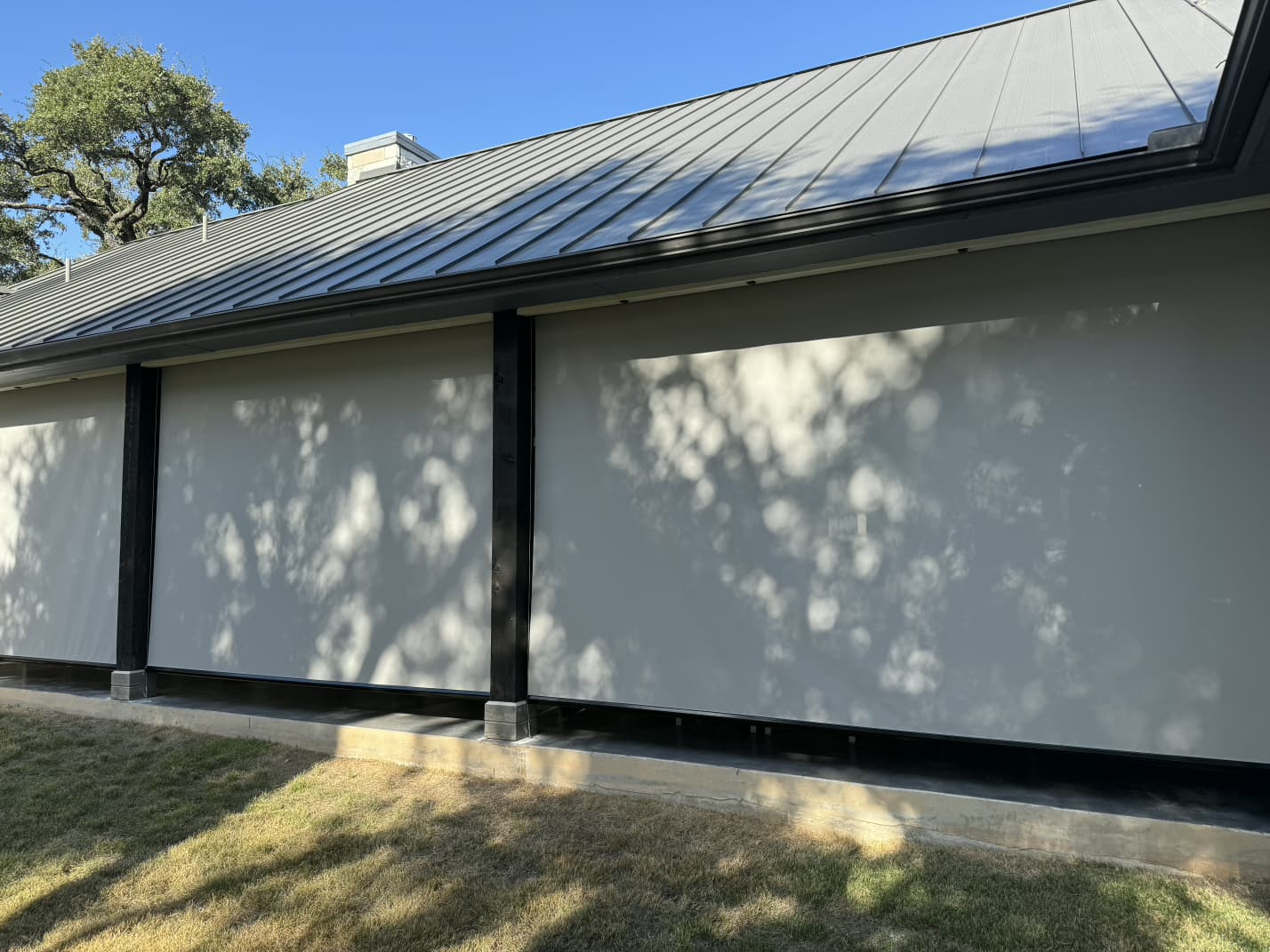 Light gray solar screen on a facade