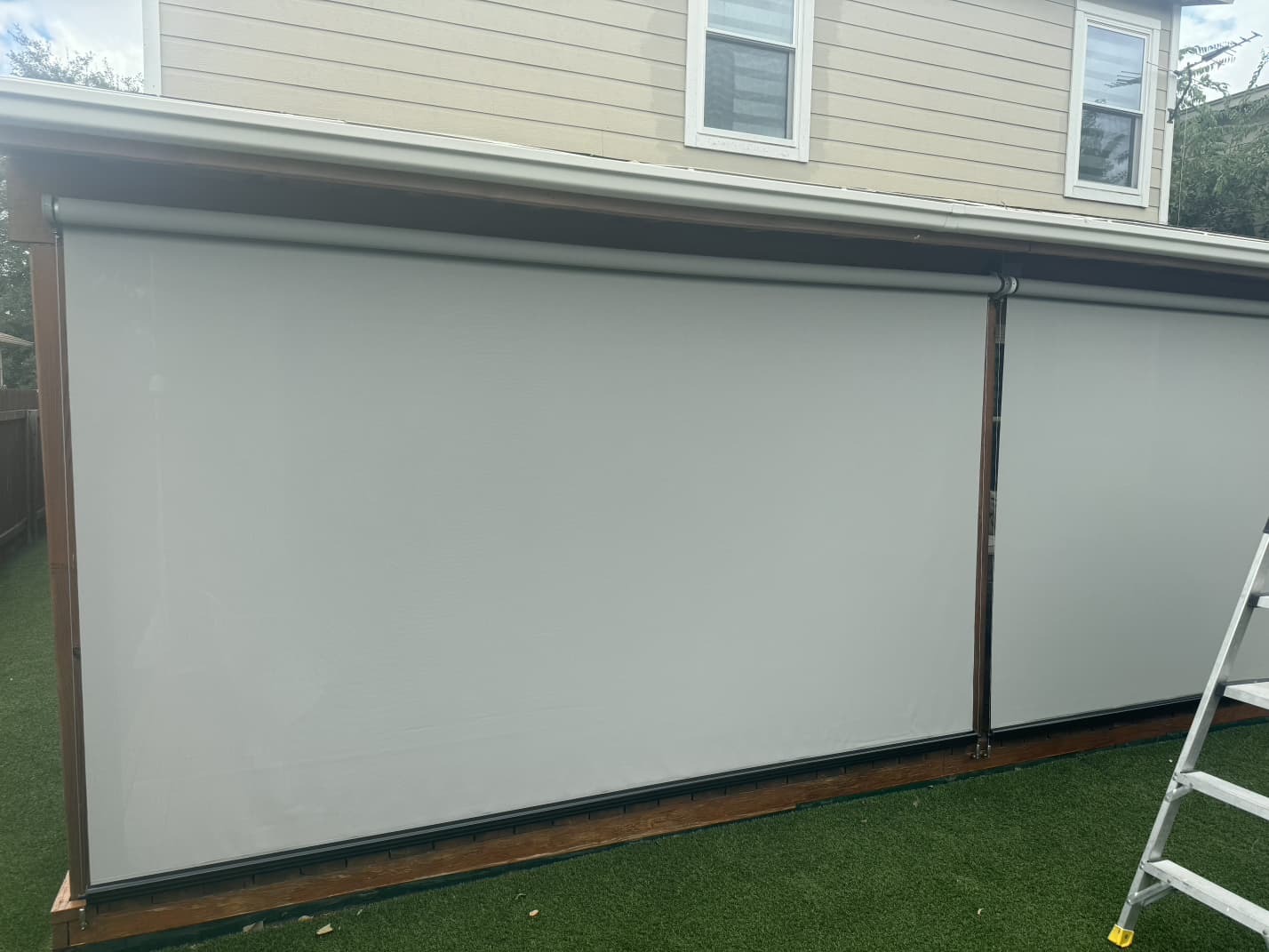 Light gray solar screen on a facade