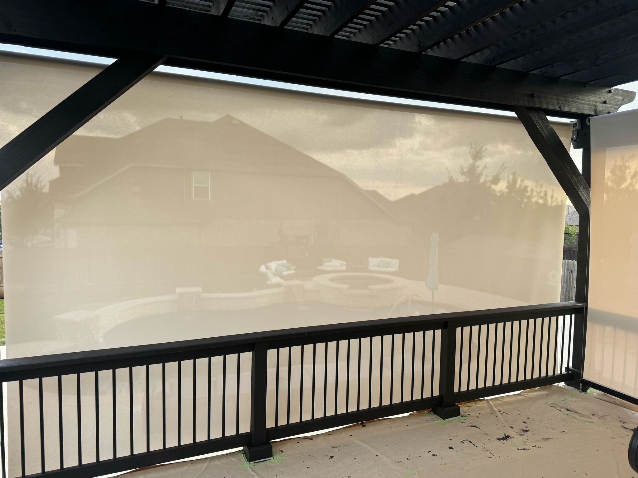Translucent sand solar screen on a pergola
