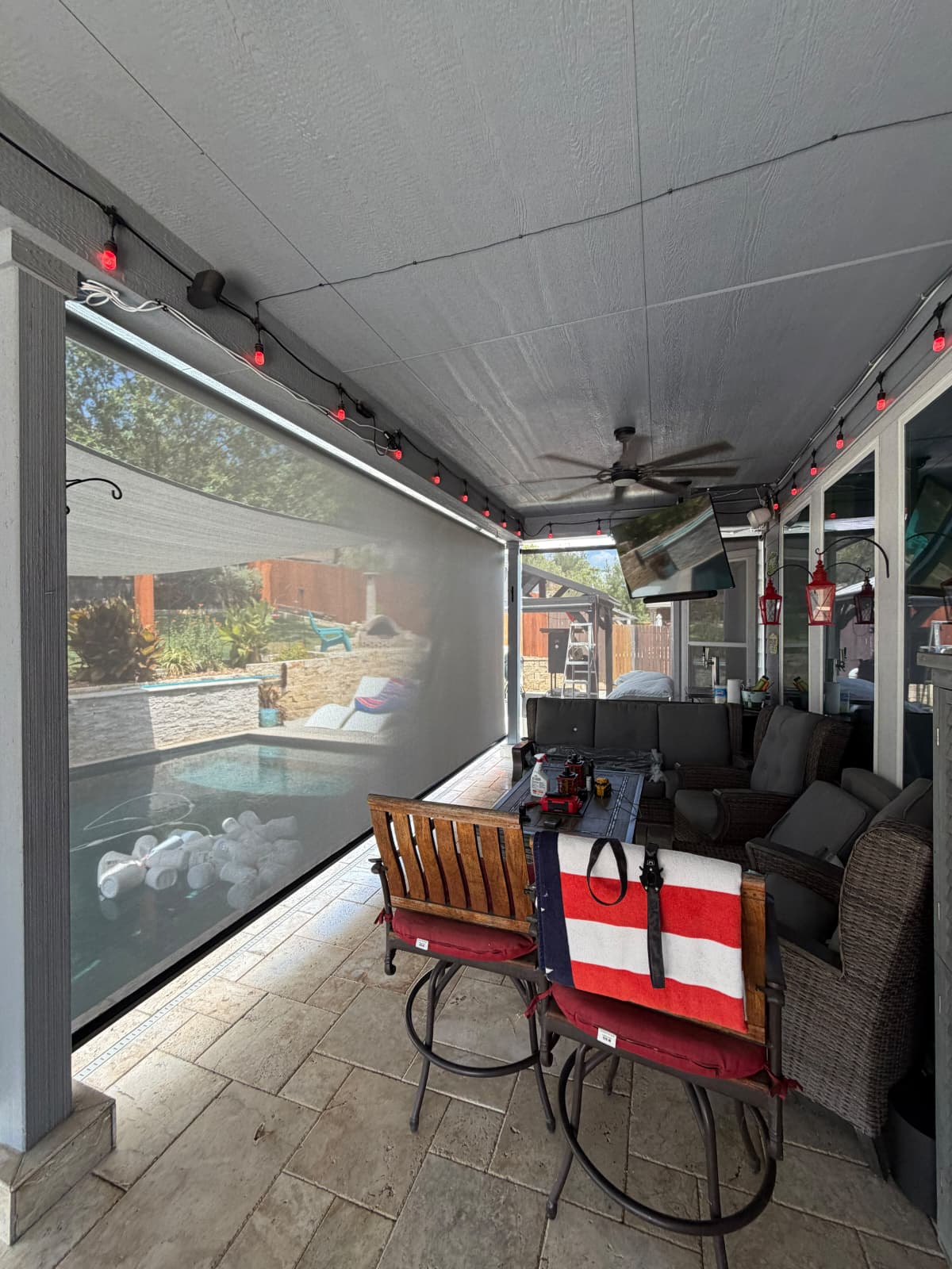 Graphite solar screen on a pergola