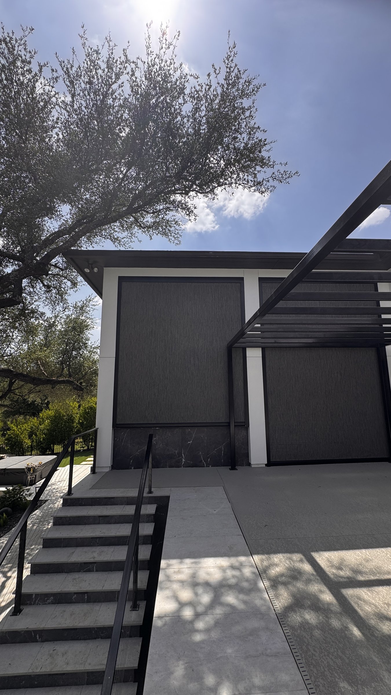 Graphite solar screen on a modern-architecture pergola