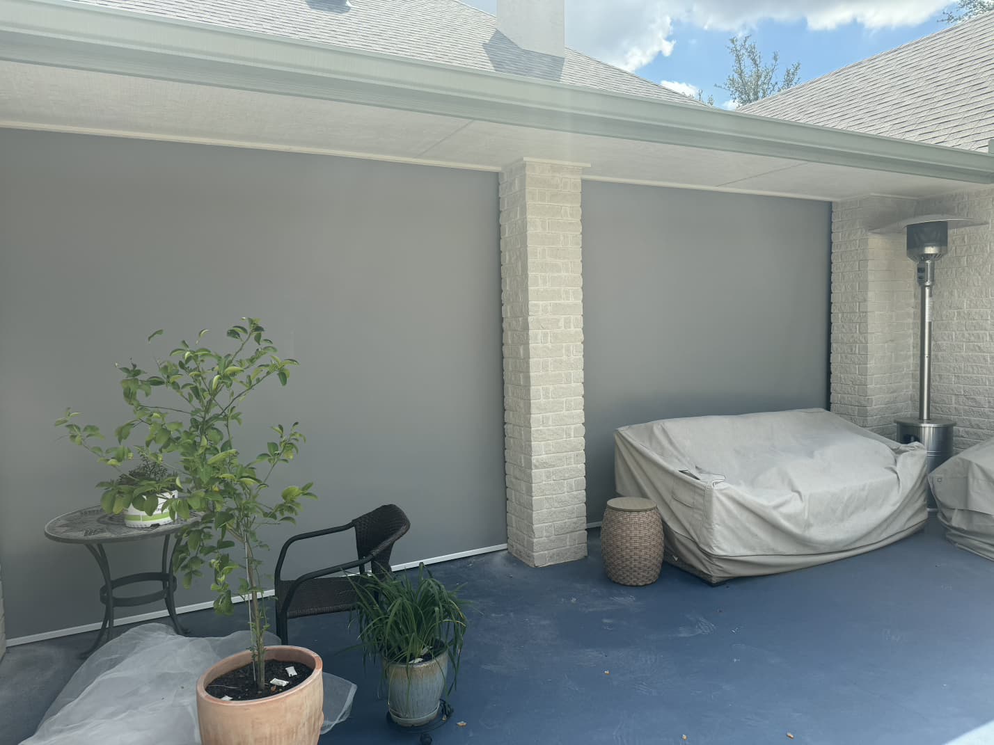 Gray solar screen on a pergola