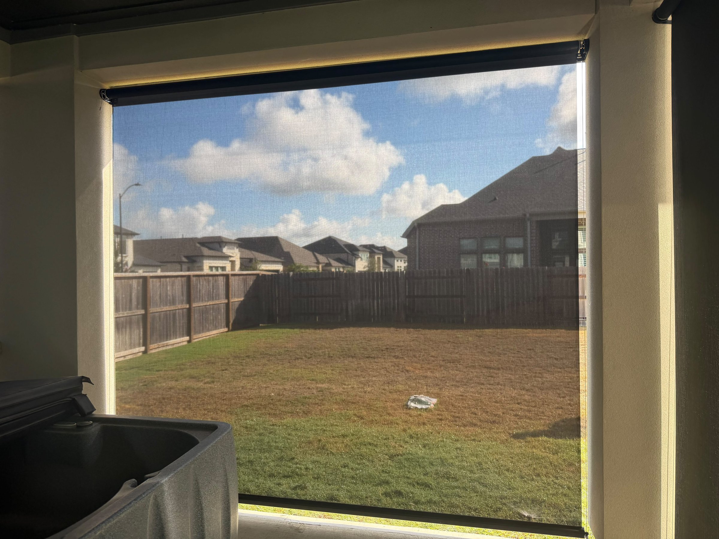 Close view of the gray solar screen mesh on a terrace