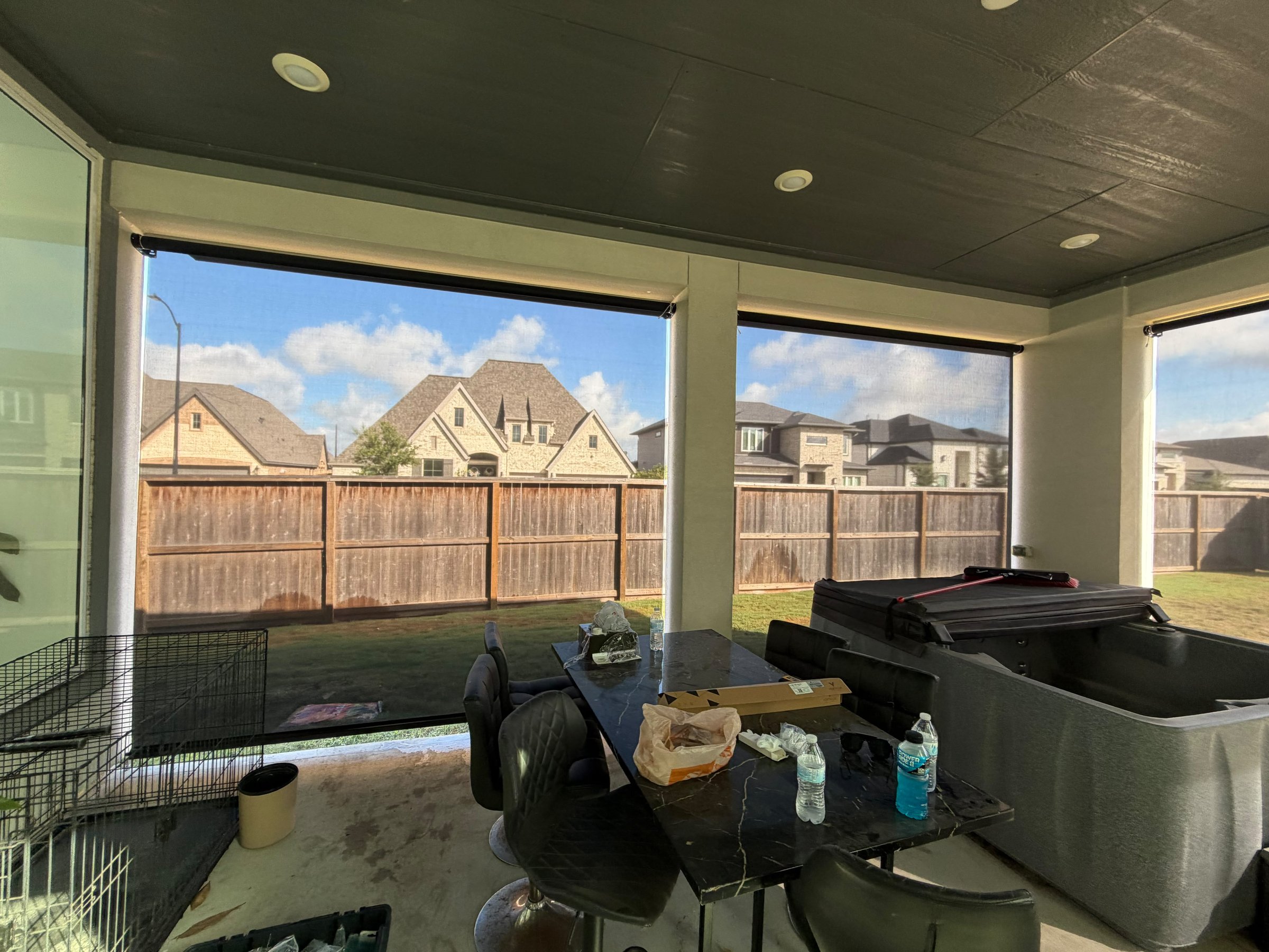 Light gray solar screen on a porch overlooking the yard