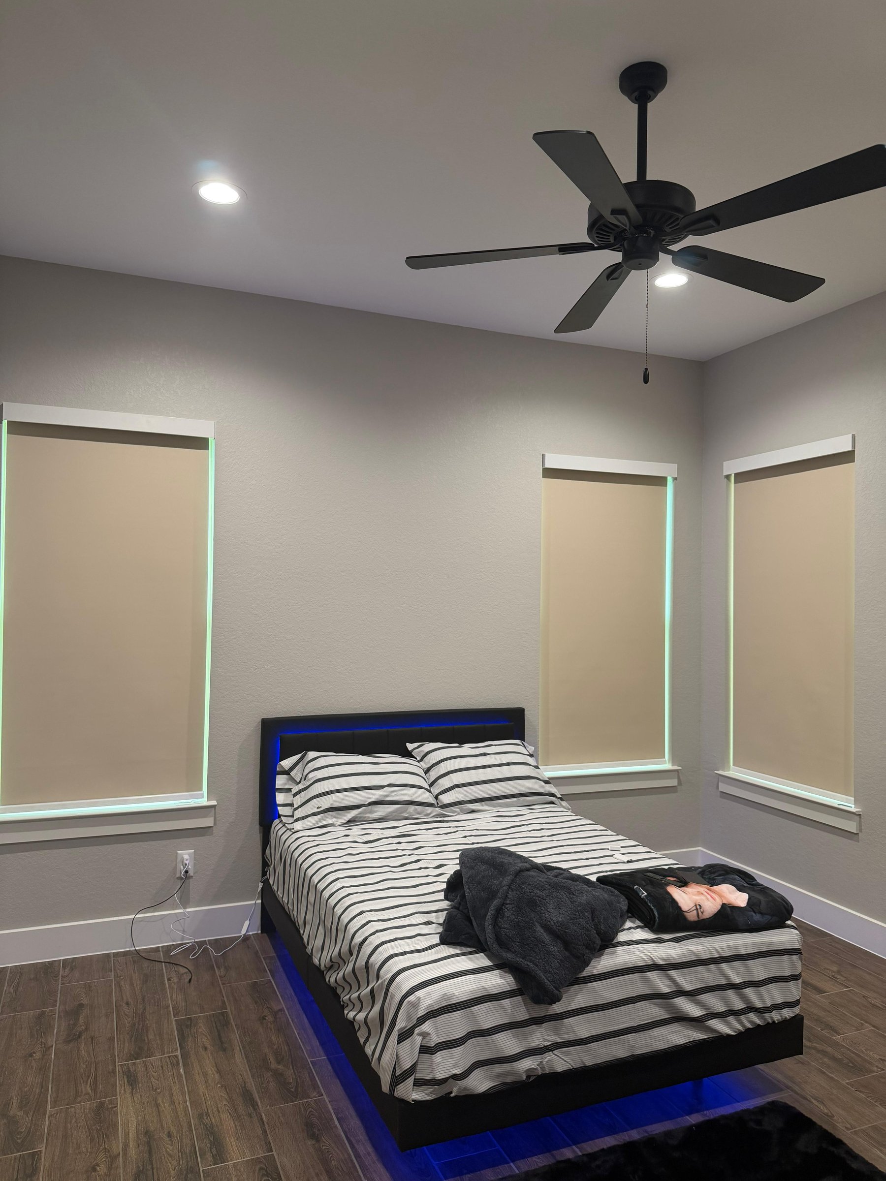 Beige blackout shades in a bedroom