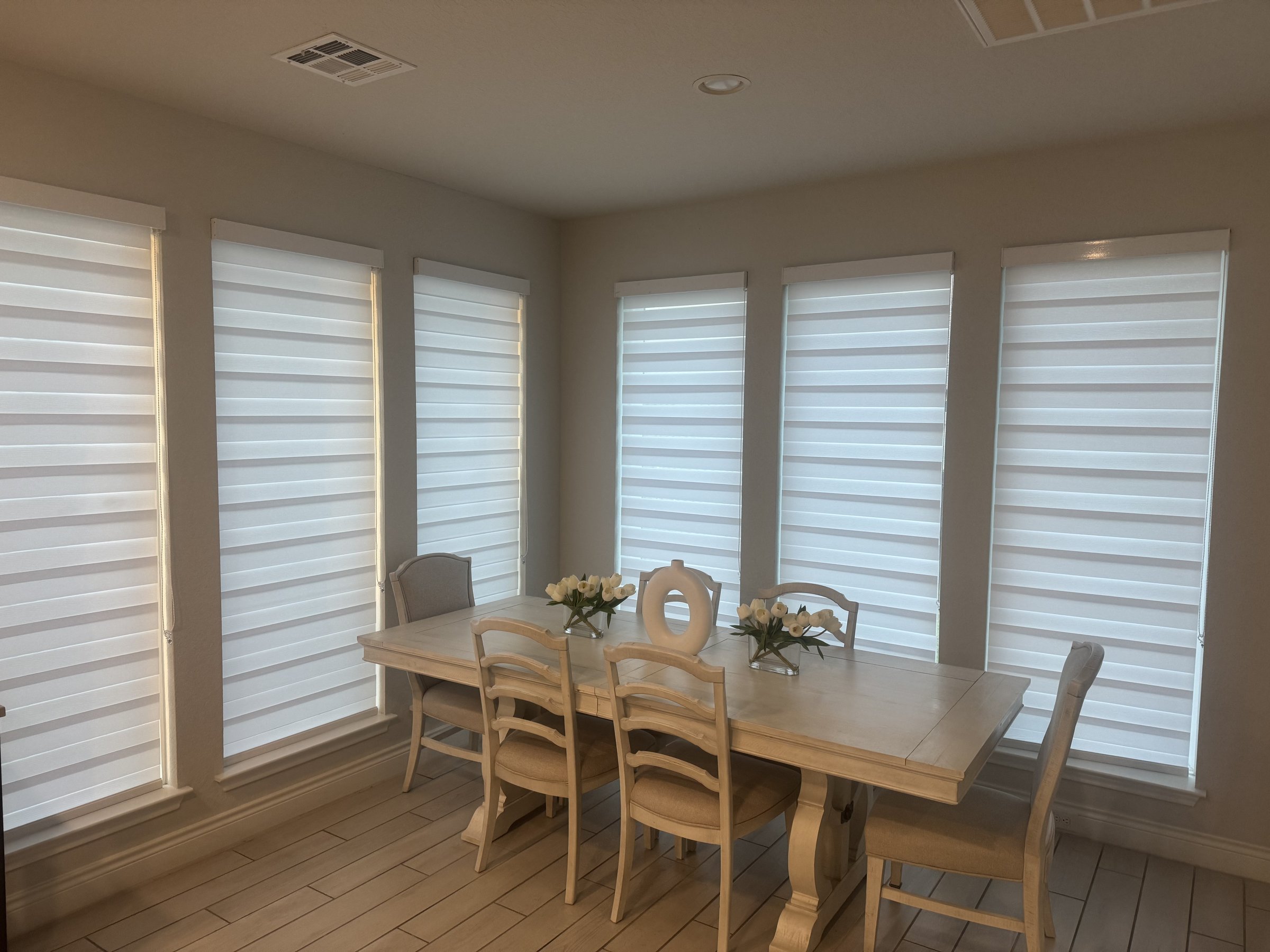 White zebra shade in a dining room
