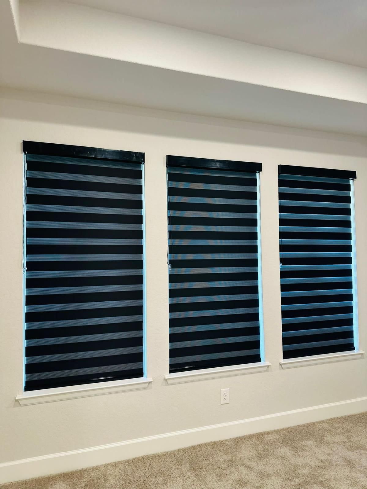 Navy zebra shade in a bedroom