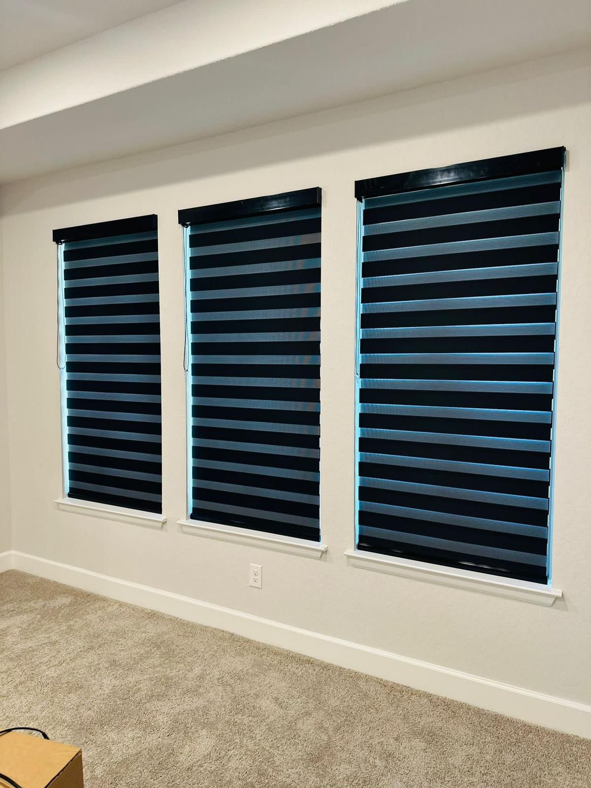 Navy zebra shade in a bedroom